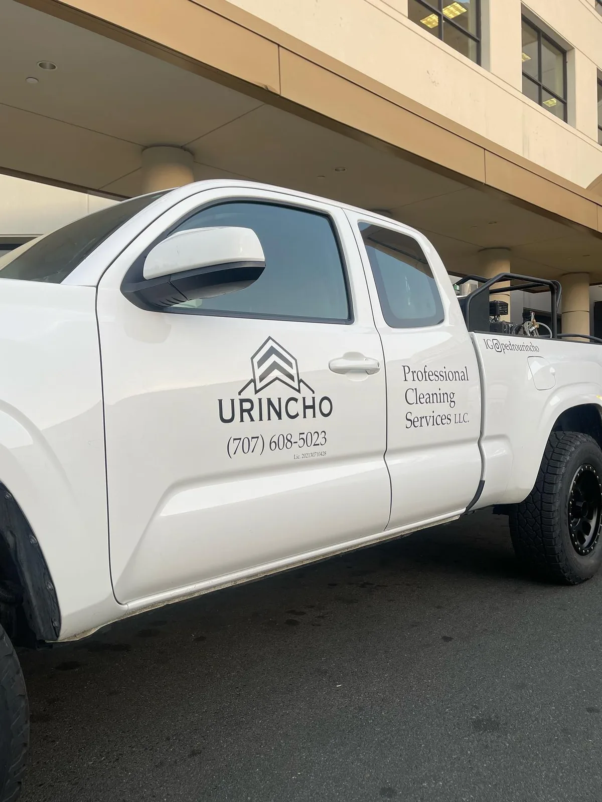 White work truck with cleaning company lettering