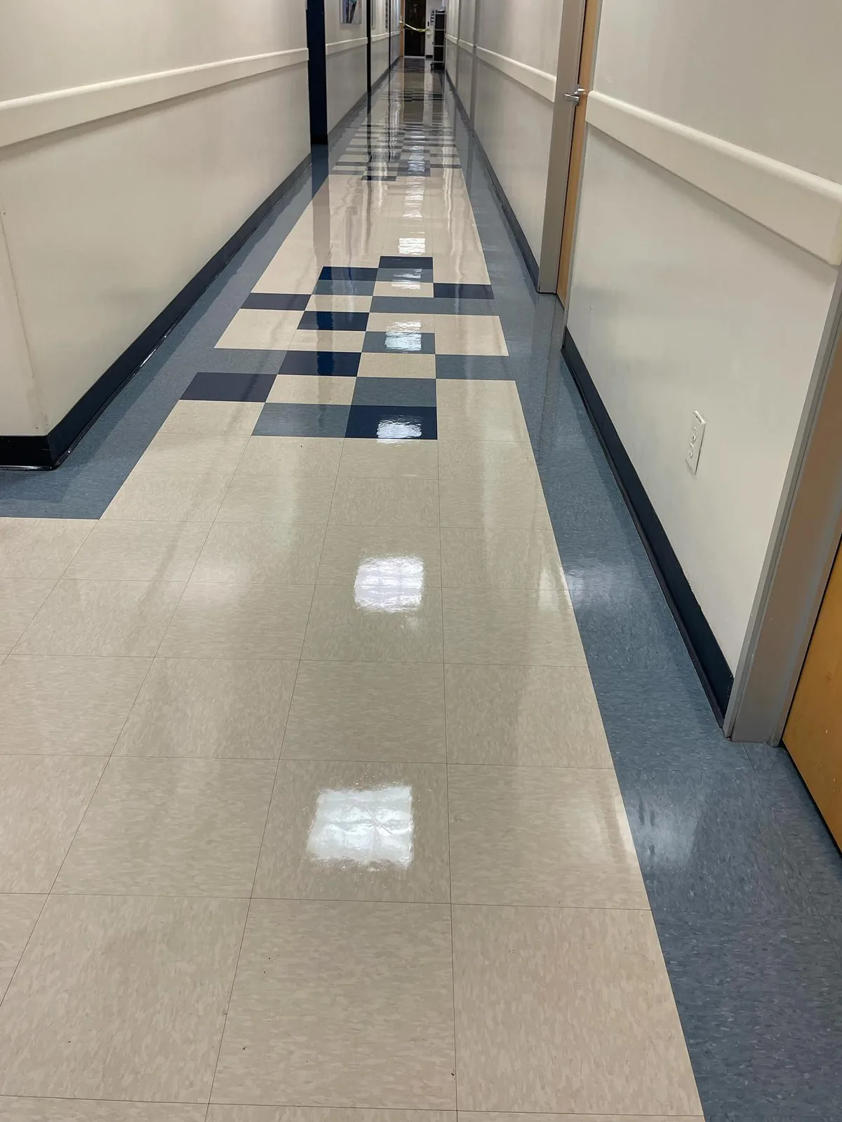 Polished tile hallway floor in a commercial building