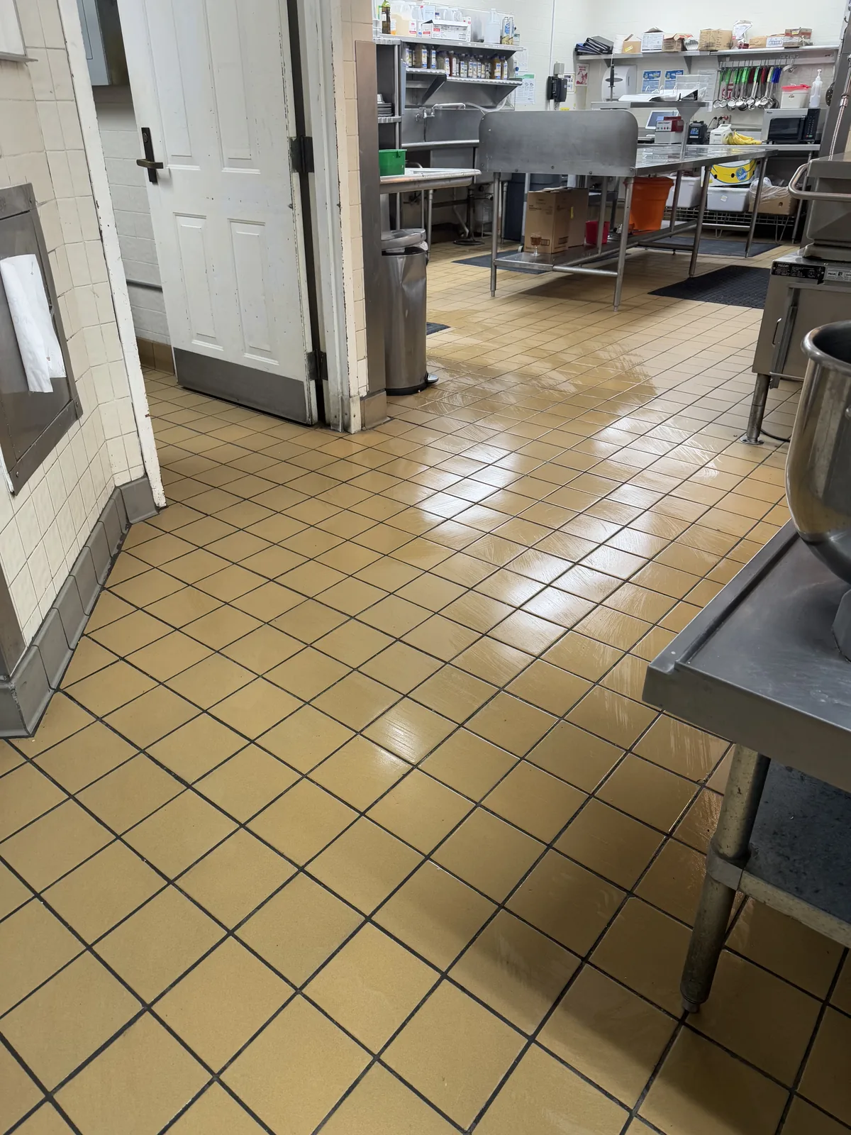 Cleaned tile floor in a commercial kitchen prep area