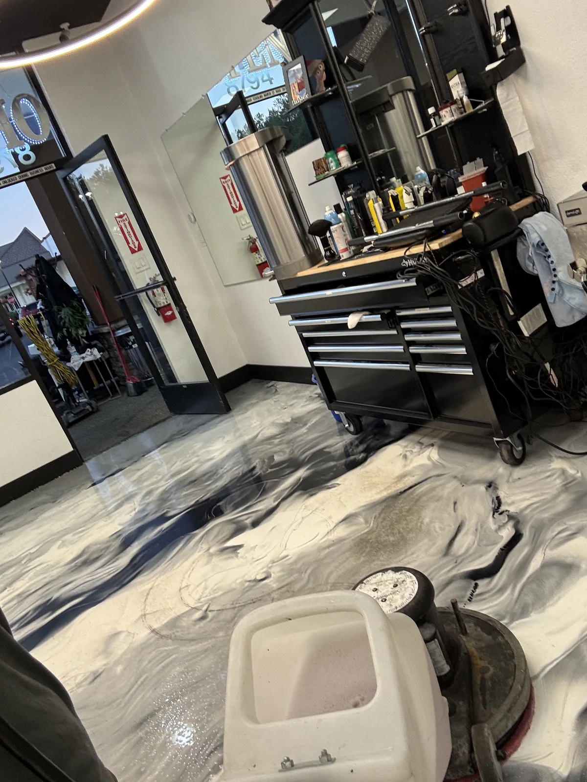 Metallic epoxy floor in a barbershop