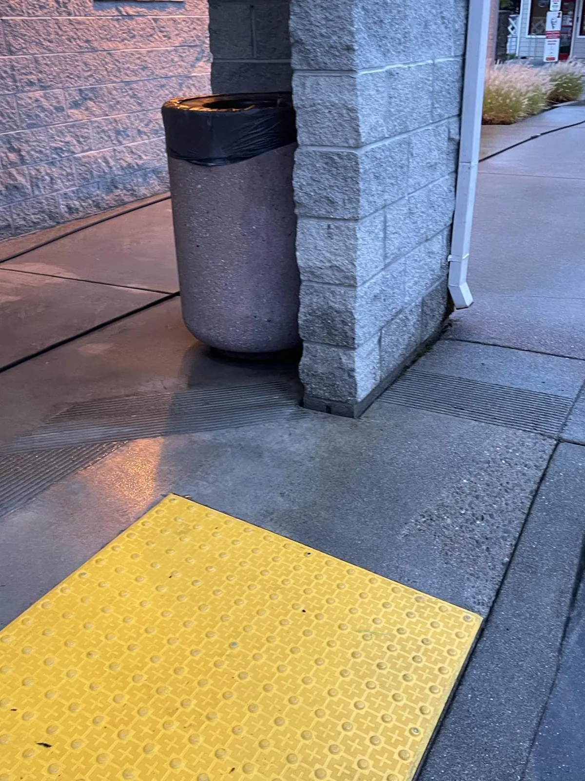 Pressure washed sidewalk and ADA pad at a building entry