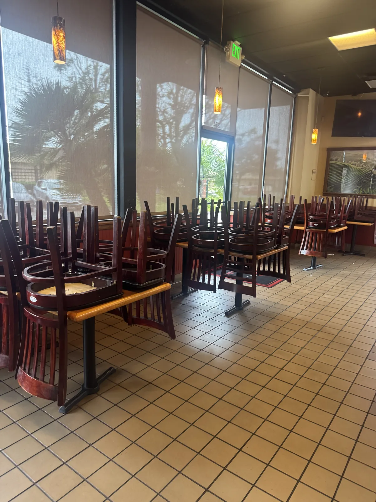 Cleaned restaurant dining floor with chairs stacked