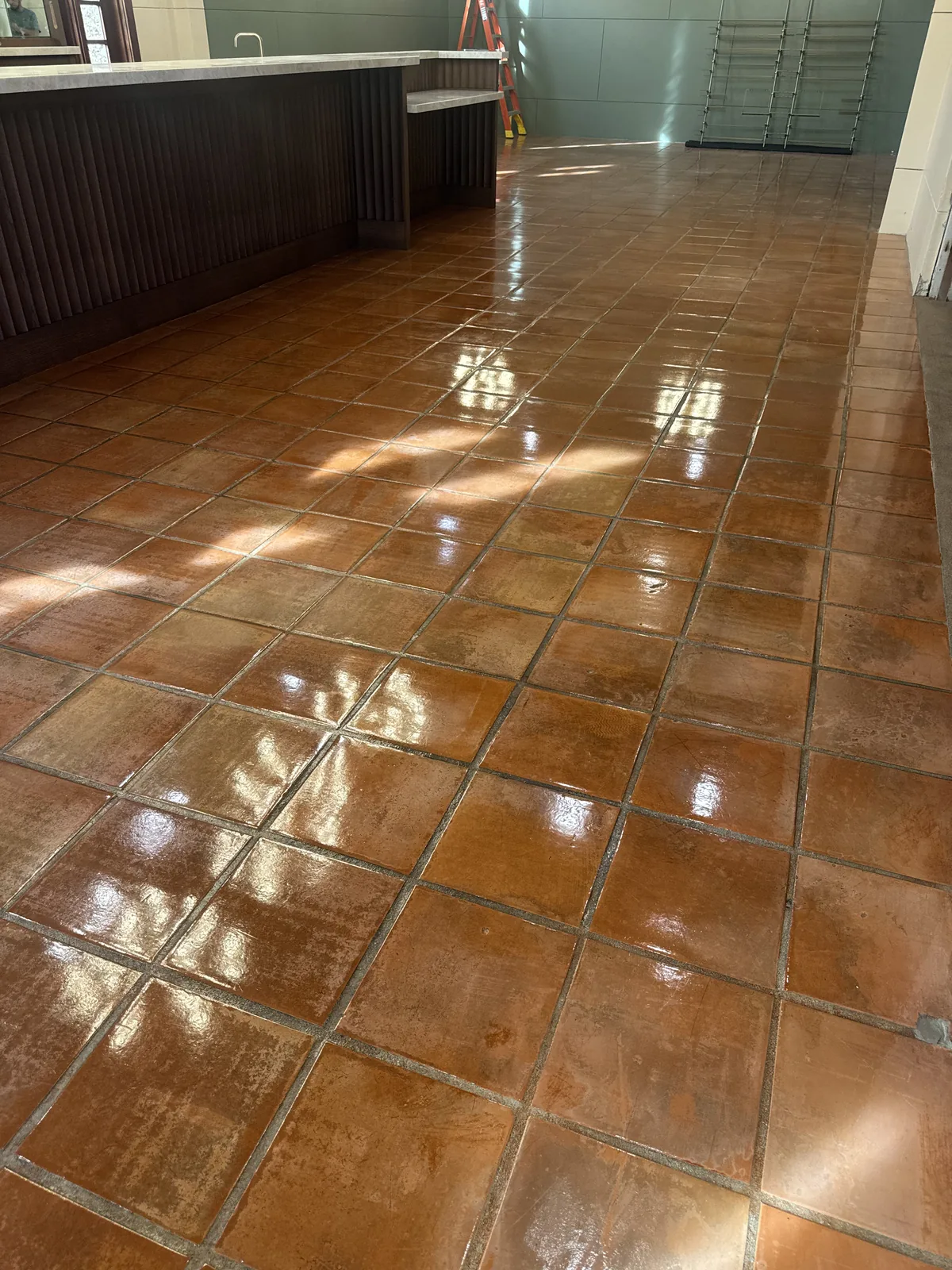 Polished saltillo tile floor in a dining room