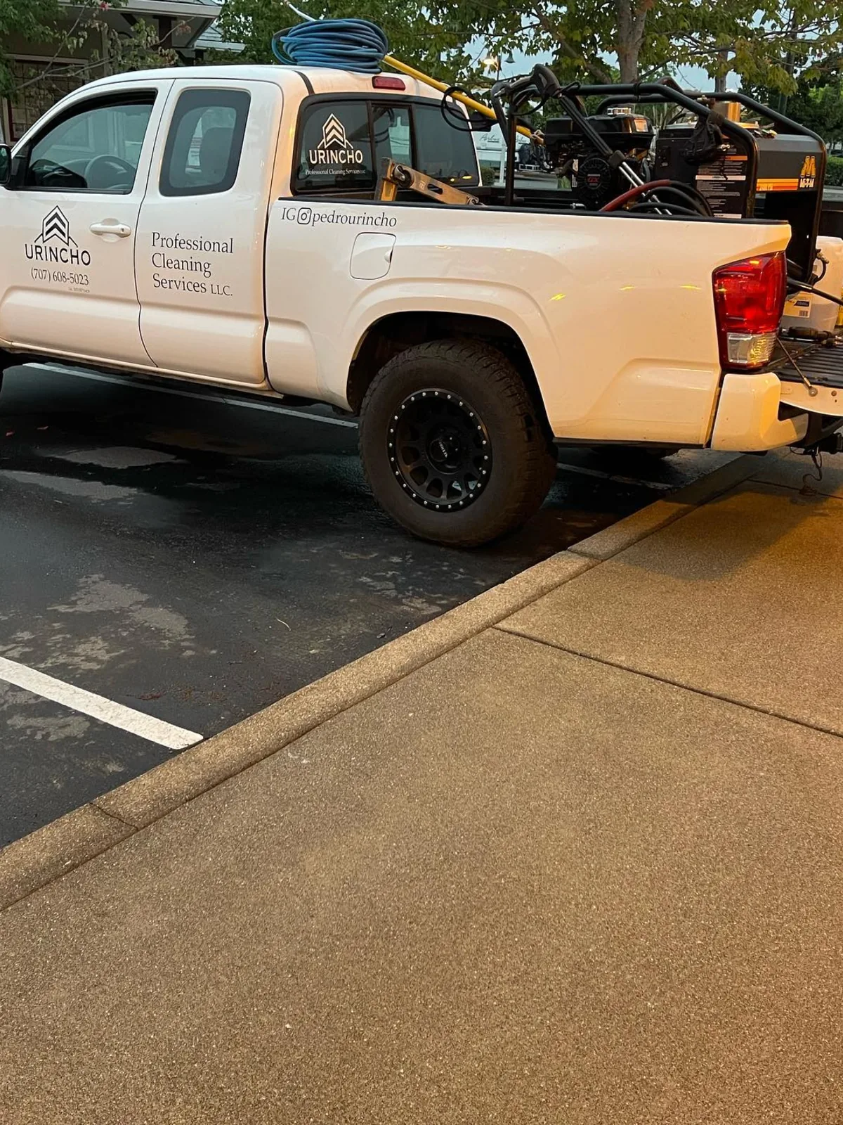 Work truck loaded with commercial cleaning equipment
